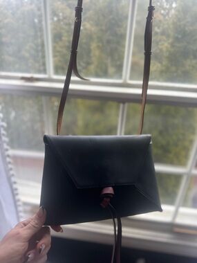 Stuart Weitzman Classic Black Leather Envelope Crossbody with Brown Strap